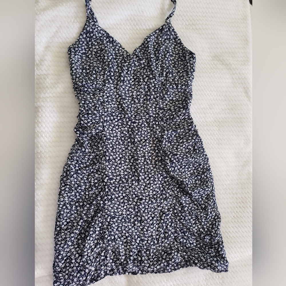 Fitted dress with ruching on the side